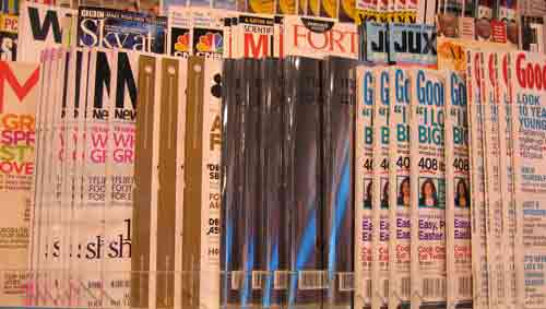 Overlapping magazine covers at a Zurich airport newsagent